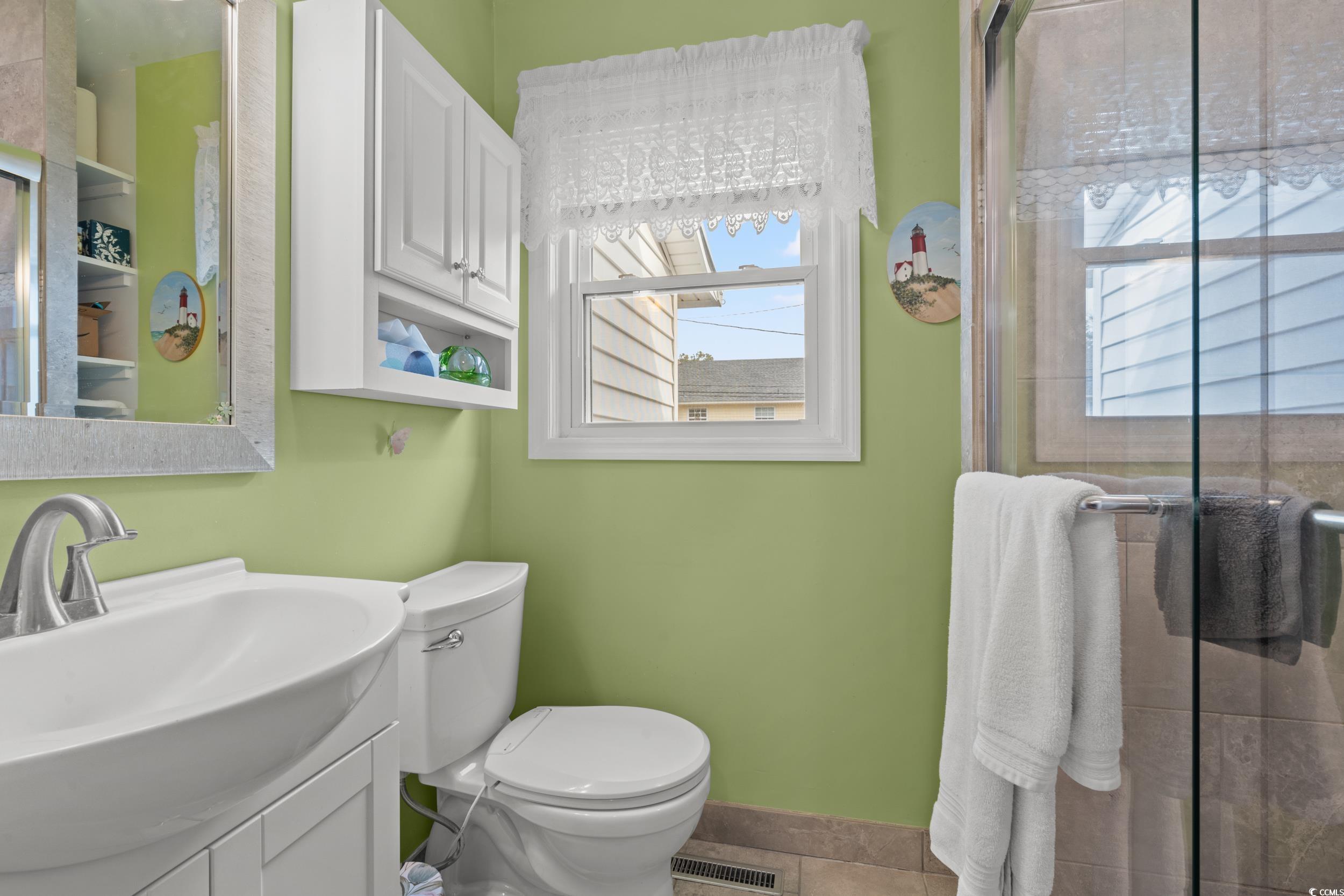 324 Edgewood Circle Conway, SC 29527 - Photo 17 of 31 Full bathroom featuring vanity, a shower with door, and tile patterned floors