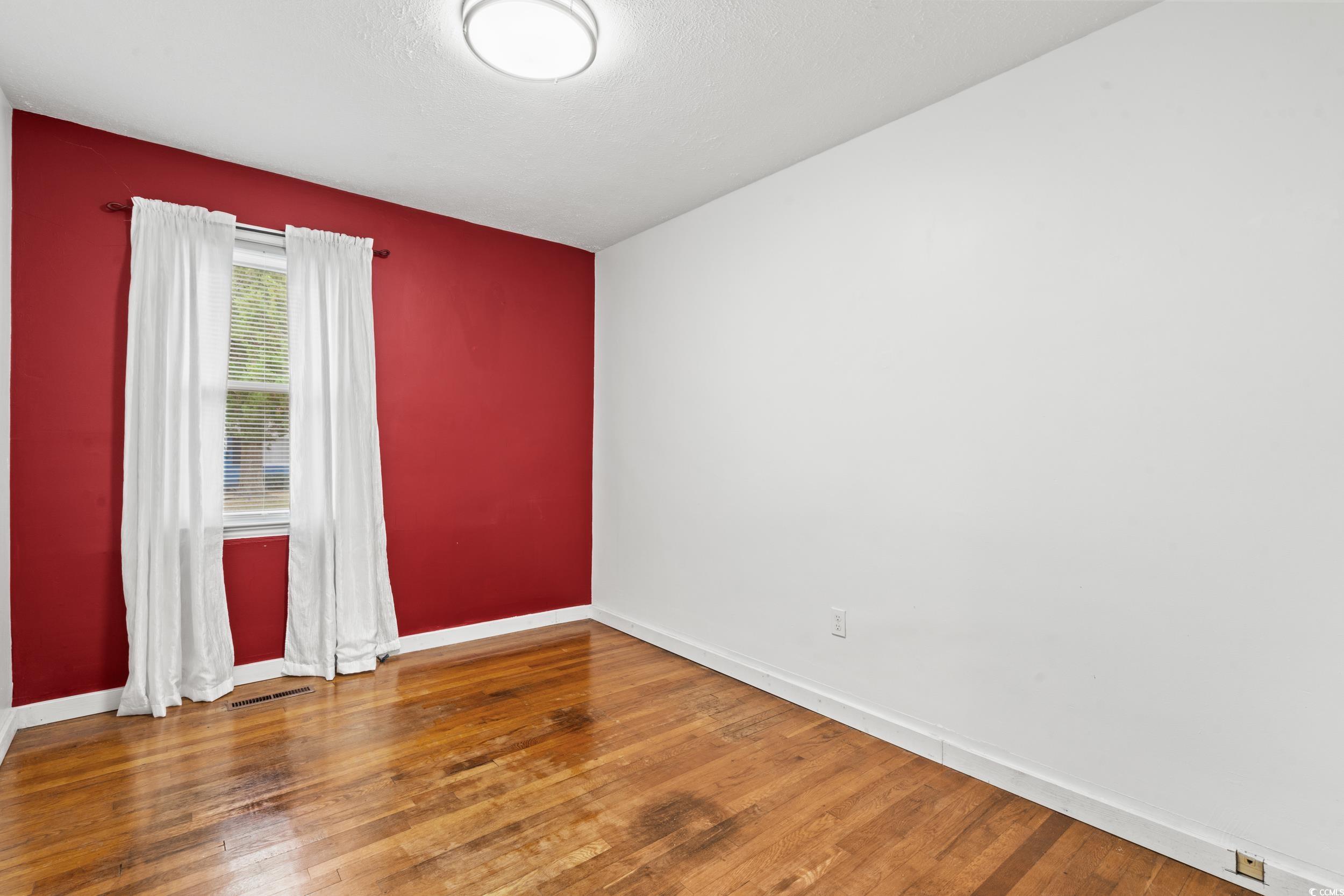 324 Edgewood Circle Conway, SC 29527 - Photo 19 of 31 Spare room featuring wood-type flooring and baseboards