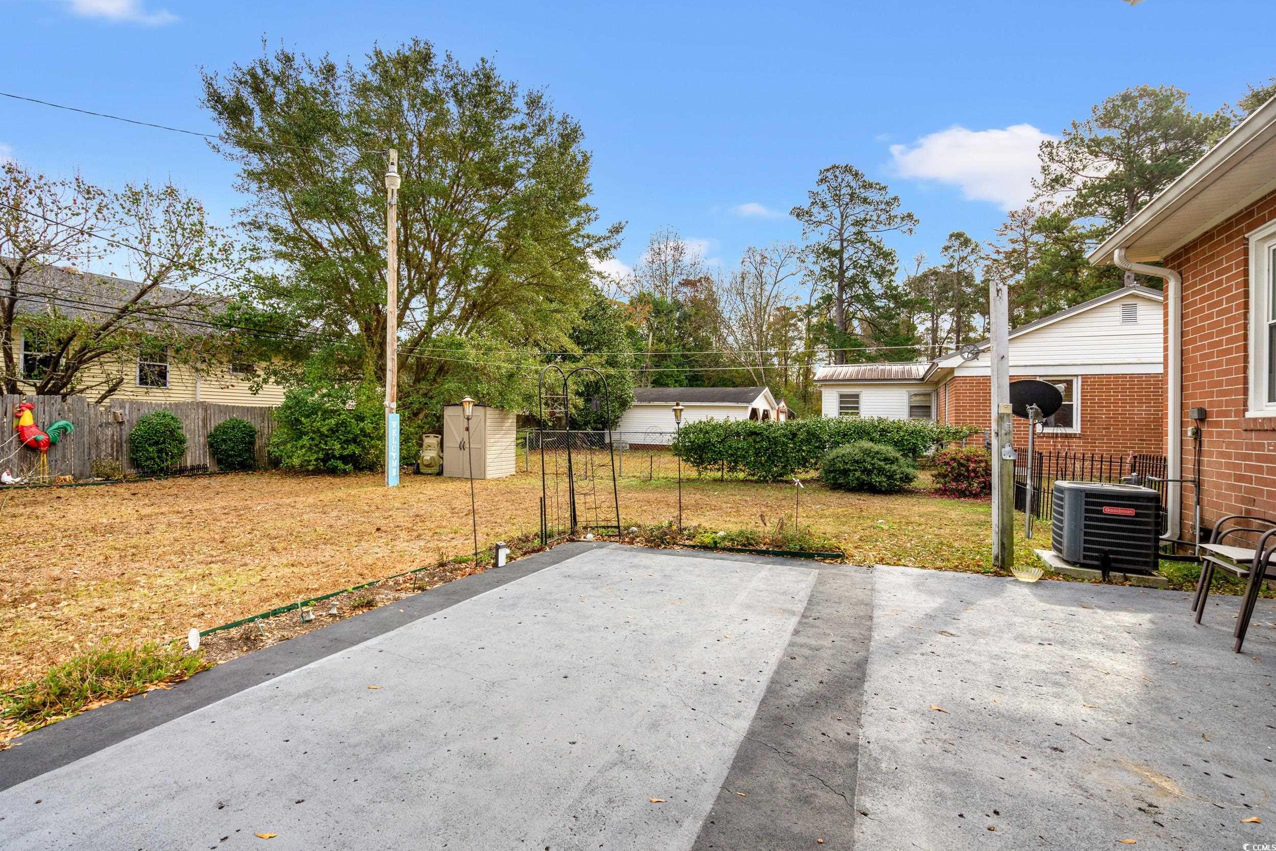 324 Edgewood Circle Conway, SC 29527 - Photo 24 of 31 Fenced backyard with a storage unit and a patio
