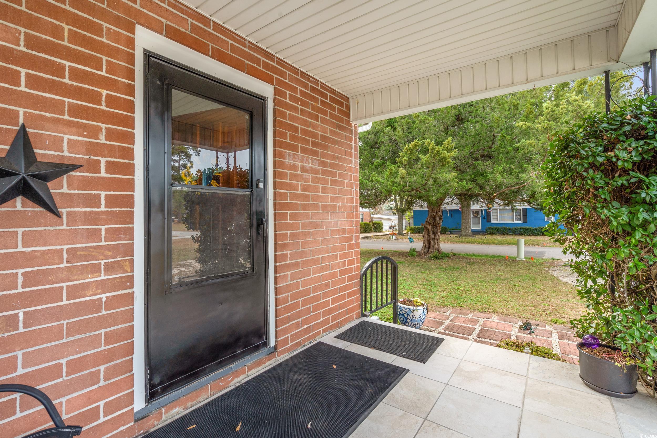 324 Edgewood Circle Conway, SC 29527 - Photo 3 of 31 Covered porch with a yard