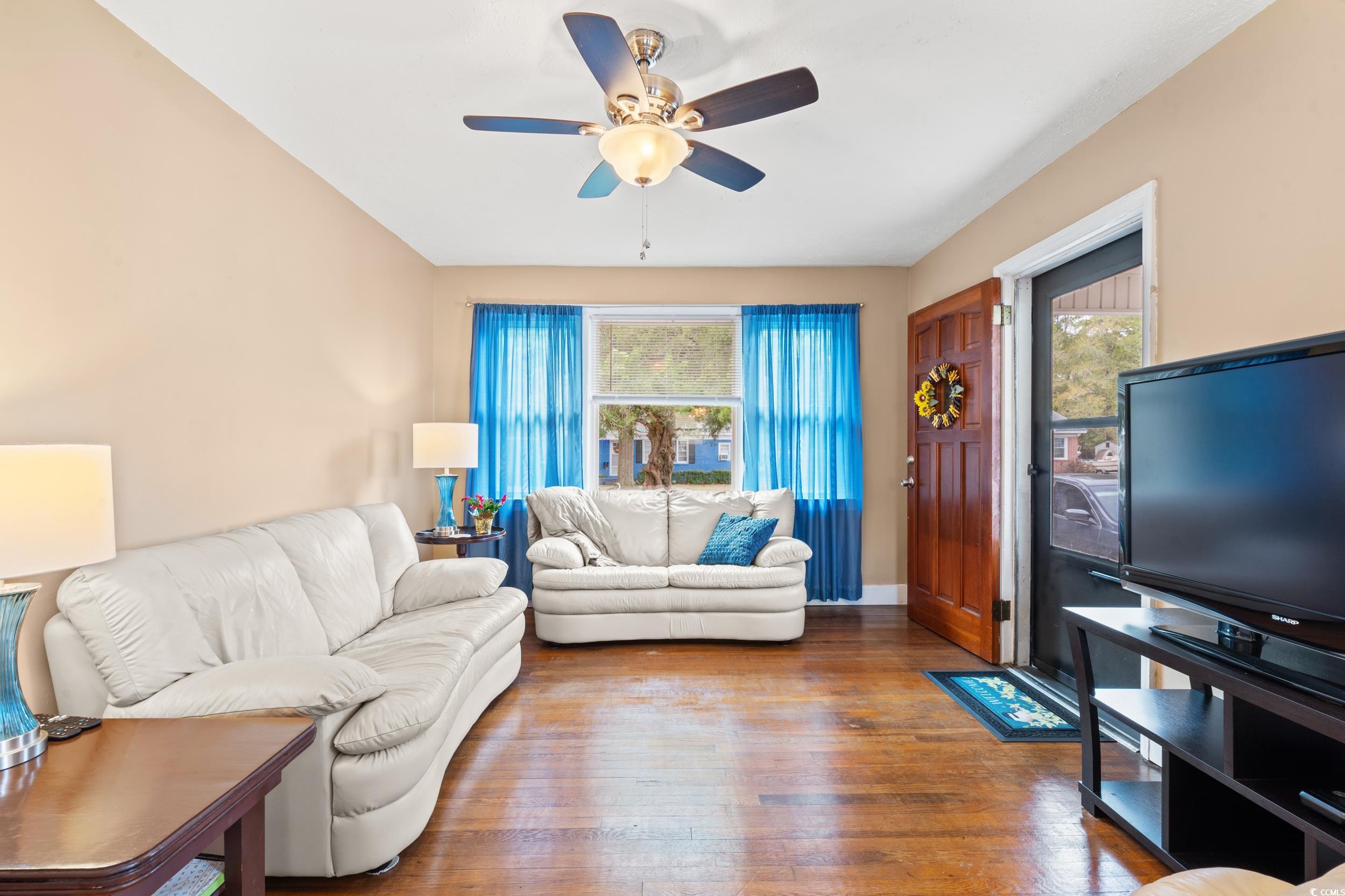 324 Edgewood Circle Conway, SC 29527 - Photo 4 of 31 Living area featuring healthy amount of natural light, hardwood / wood-style flooring, and ceiling fan