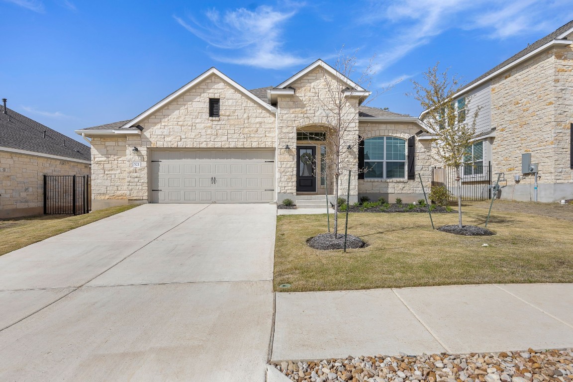 521 Panzano Drive Georgetown, TX 78628 - Photo 1 of 1 a front view of a house with garden