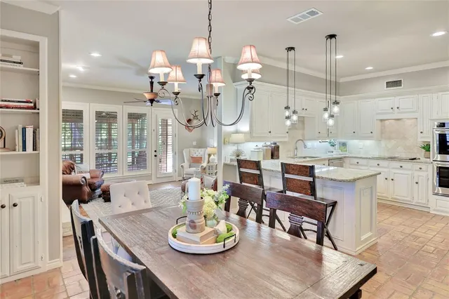 a kitchen with a dining table wooden floor dining table and chairs