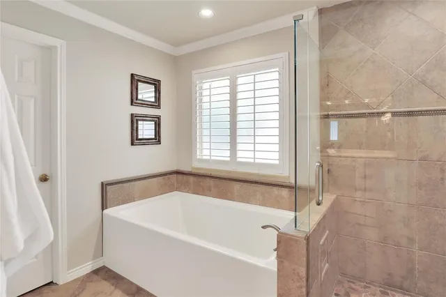 a white bath tub sitting next to a window