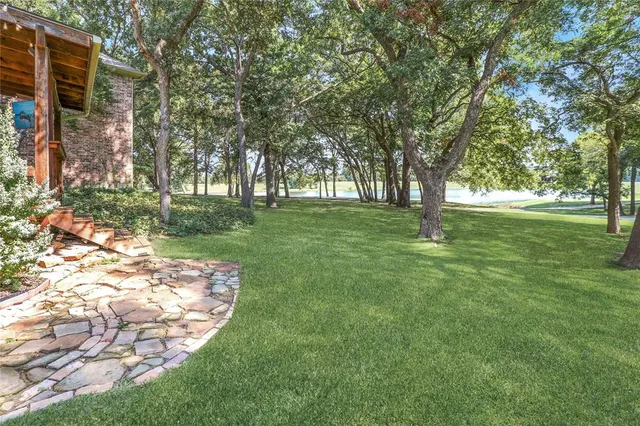 a backyard of a house with lots of green space