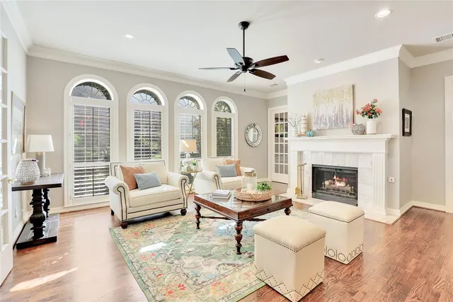 a living room with furniture fireplace and rug