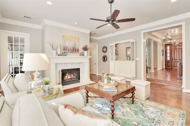 a living room with furniture a fireplace and a table