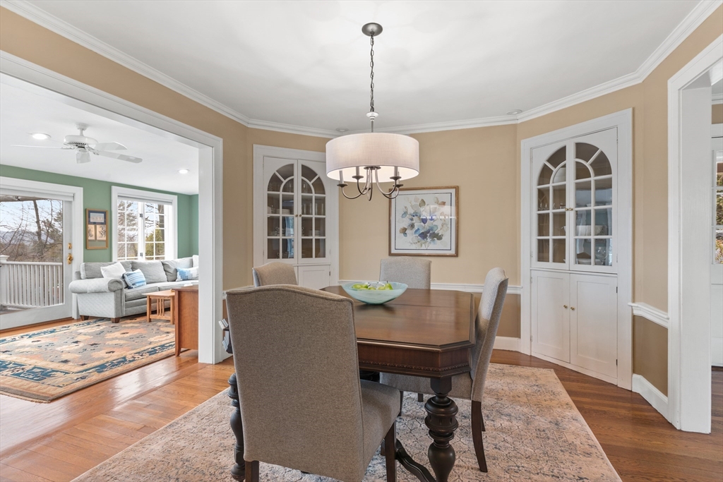 29 Allen Road Winchester, MA 01890 - Photo 12 of 42 a dining room with furniture a chandelier and wooden floor