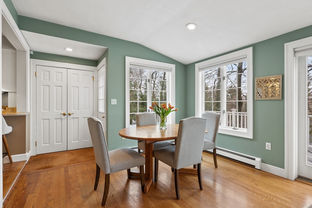 29 Allen Road Winchester, MA 01890 - Photo 18 of 42 a dining room with furniture a chandelier and wooden floor