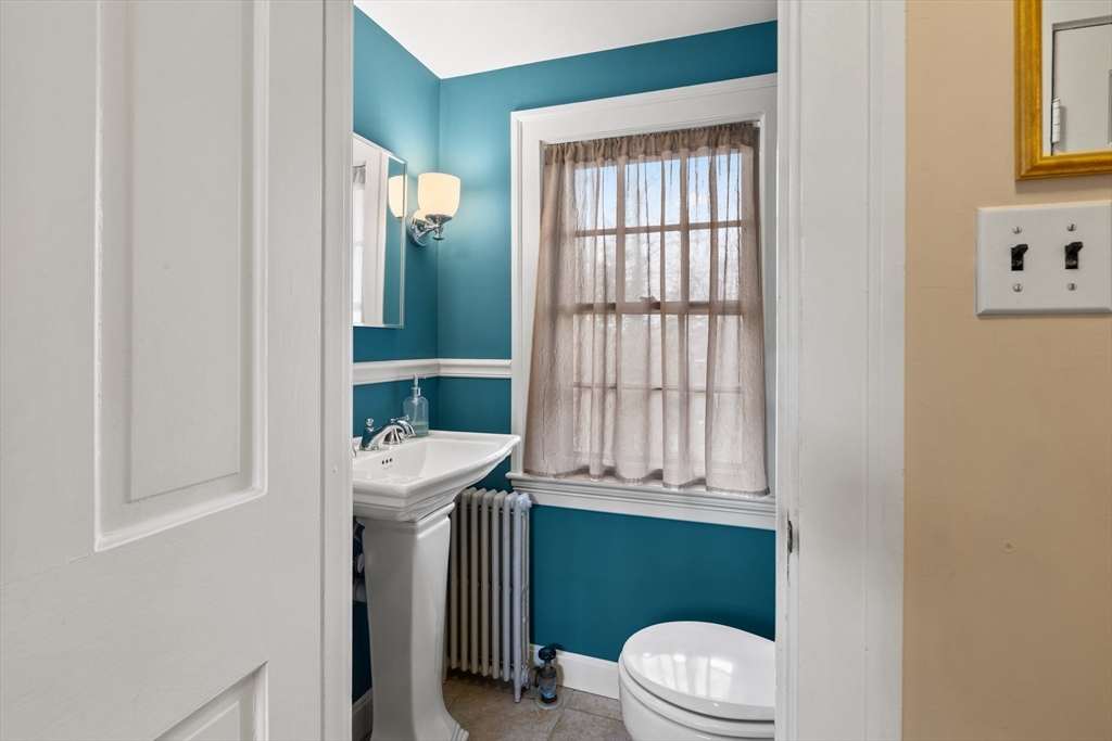 29 Allen Road Winchester, MA 01890 - Photo 23 of 42 a bathroom with a toilet a sink and a window