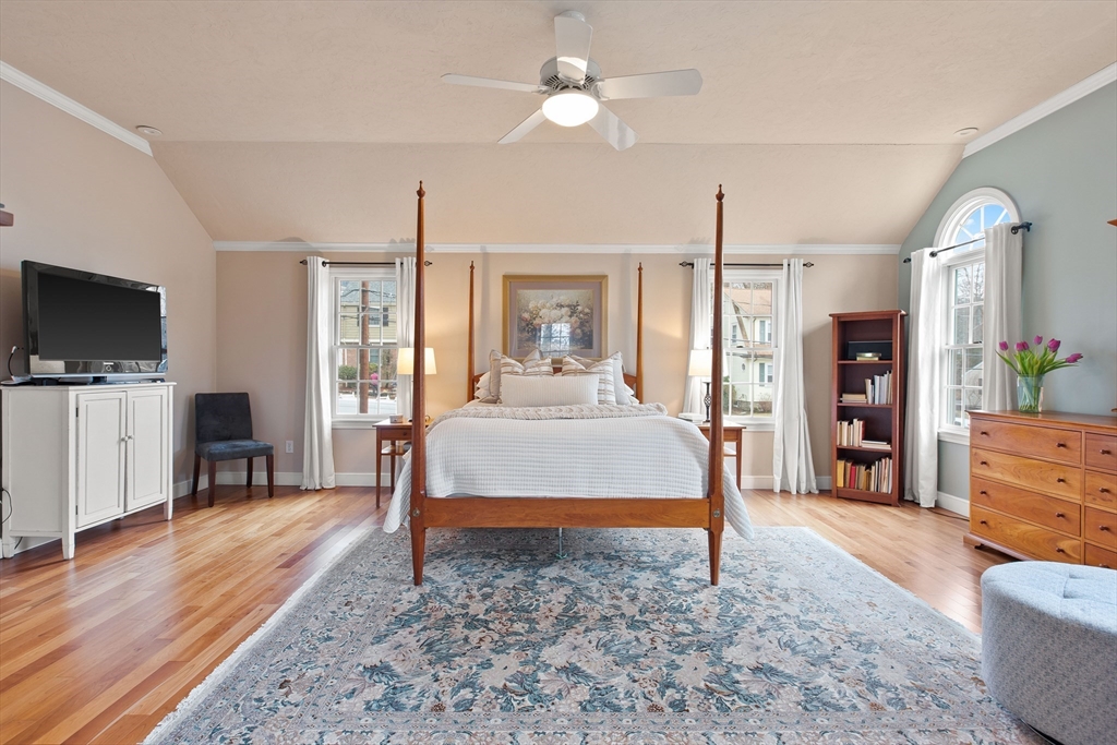 29 Allen Road Winchester, MA 01890 - Photo 25 of 42 a bedroom with a bed and a flat screen tv