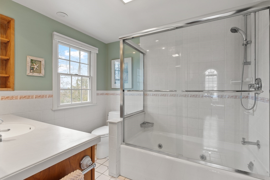 29 Allen Road Winchester, MA 01890 - Photo 28 of 42 a bathroom with a bathtub and a shower