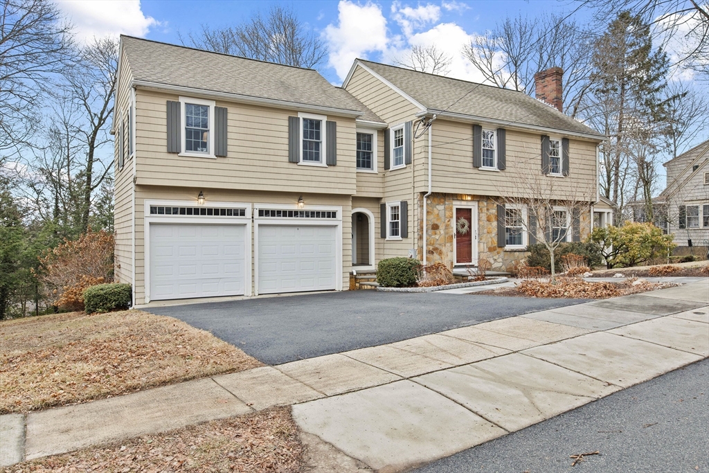 29 Allen Road Winchester, MA 01890 - Photo 3 of 42 a front view of a house with a yard and garage