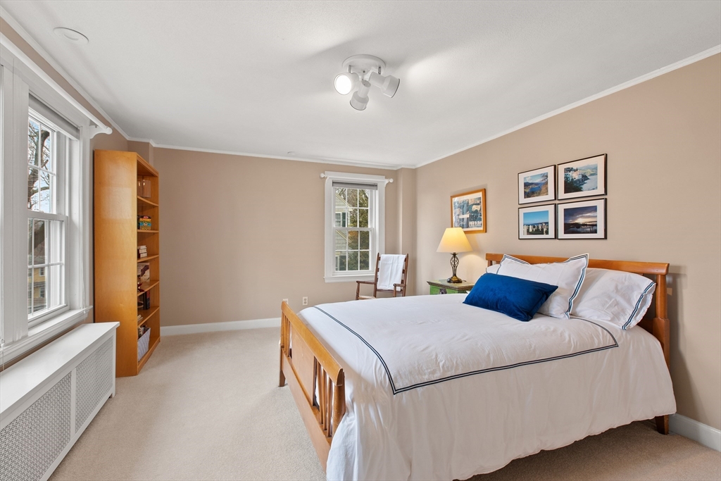 29 Allen Road Winchester, MA 01890 - Photo 31 of 42 a bedroom with a large bed and a window