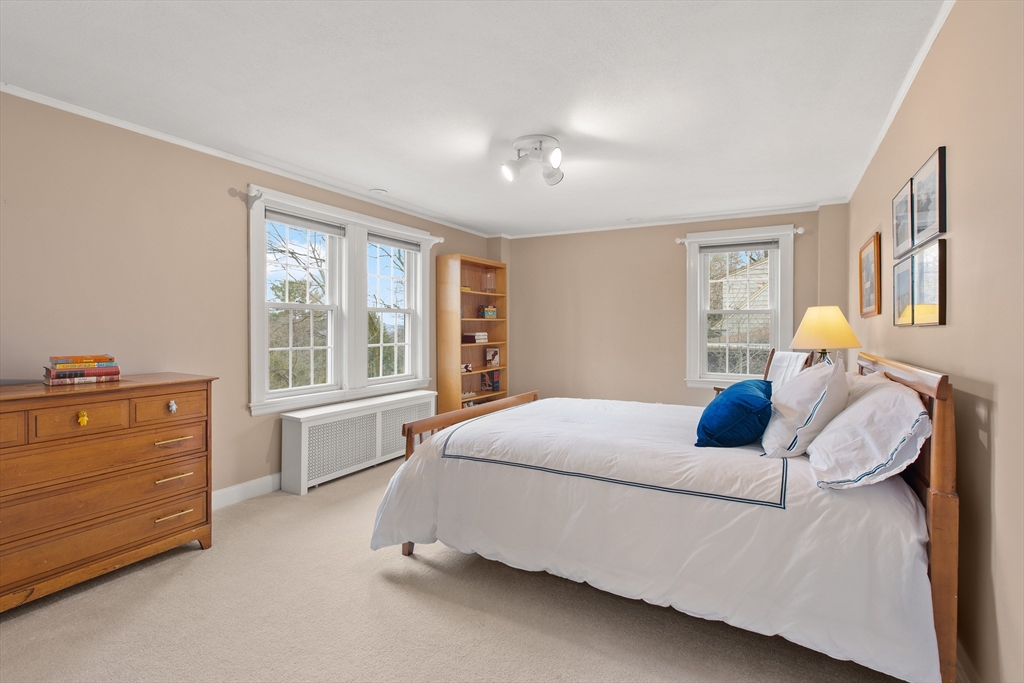 29 Allen Road Winchester, MA 01890 - Photo 32 of 42 a bedroom with a bed and wooden floor