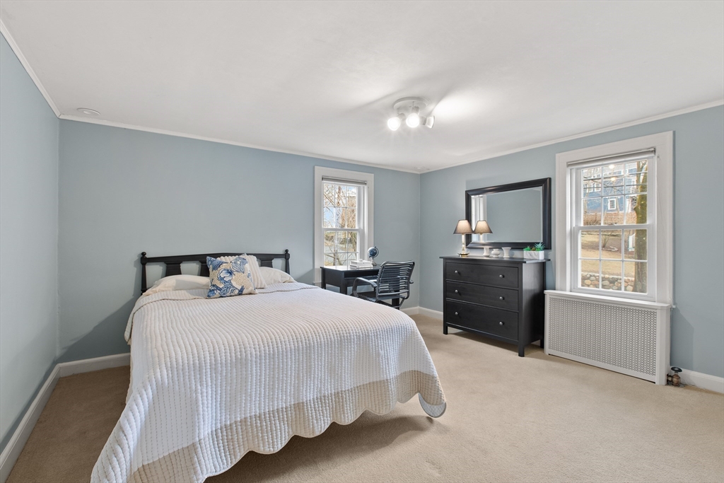29 Allen Road Winchester, MA 01890 - Photo 33 of 42 a bedroom with a bed and dresser with window