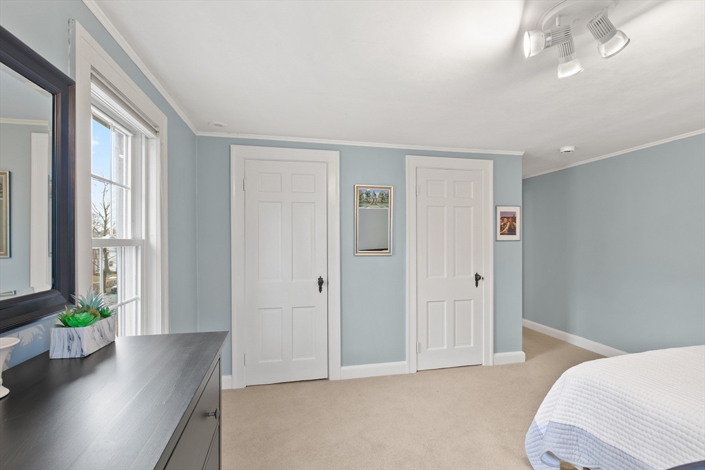 29 Allen Road Winchester, MA 01890 - Photo 34 of 42 a bedroom with furniture and a potted plant