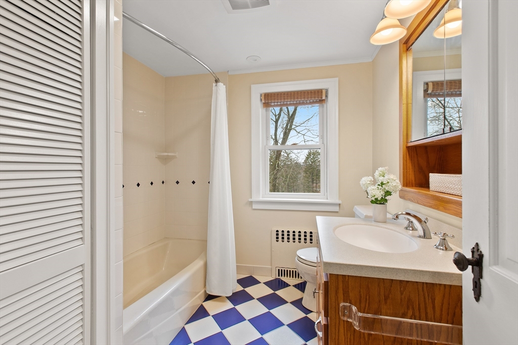 29 Allen Road Winchester, MA 01890 - Photo 36 of 42 a bathroom with a sink a mirror and a shower