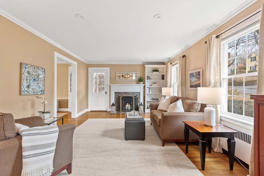 29 Allen Road Winchester, MA 01890 - Photo 8 of 42 a living room with furniture large window and a fireplace