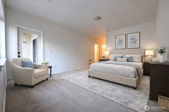 a bathroom with a sink a toilet a mirror and shower