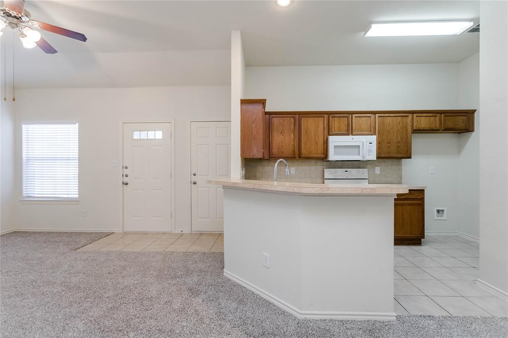 436 Blake Lane Midlothian, TX 76065 - Photo 16 of 26 a kitchen with stainless steel appliances a sink and a stove