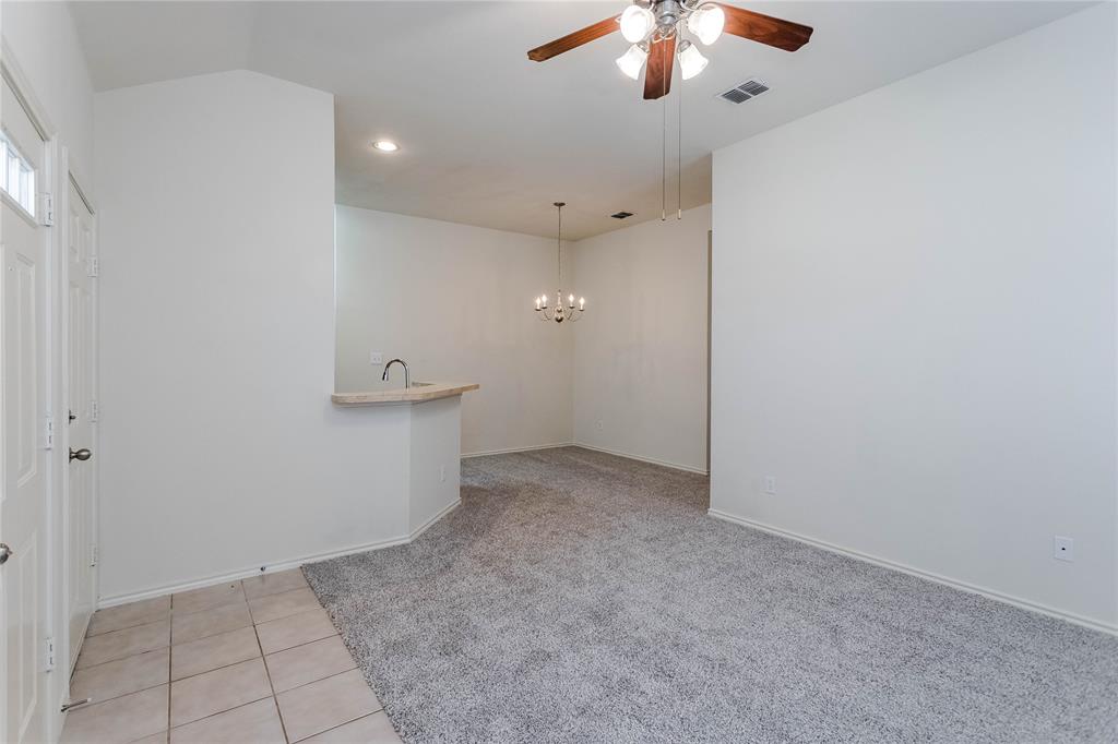 436 Blake Lane Midlothian, TX 76065 - Photo 6 of 26 en empty room with an entryway and chandelier fan