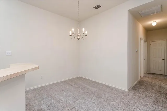 a view of a chandelier in big room
