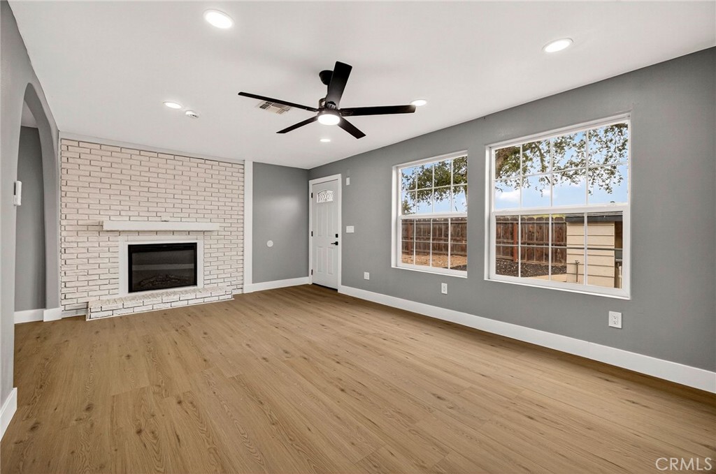 7040 Fulton Avenue Palermo, CA 95968 - Photo 11 of 53 a view of an empty room with a window and wooden floor