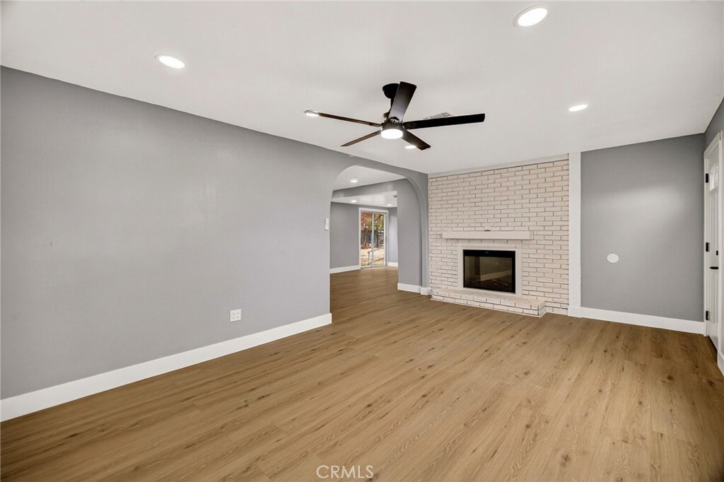 7040 Fulton Avenue Palermo, CA 95968 - Photo 12 of 53 a view of empty room with wooden floor and fireplace