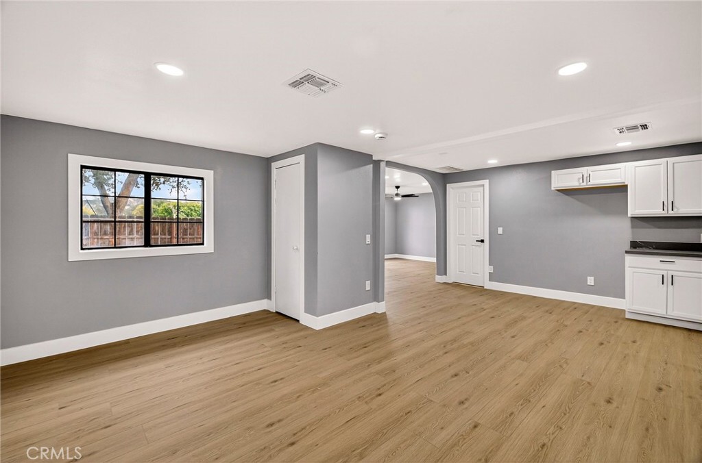 7040 Fulton Avenue Palermo, CA 95968 - Photo 16 of 53 a view of empty room with wooden floor and window