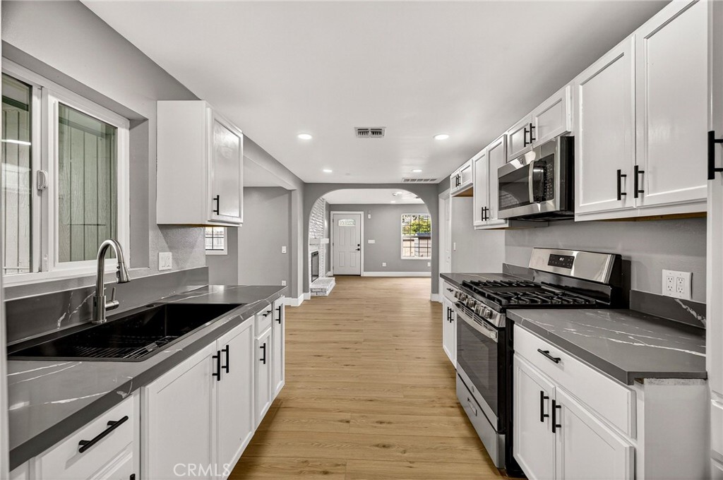 7040 Fulton Avenue Palermo, CA 95968 - Photo 20 of 53 a large kitchen with stainless steel appliances granite countertop a sink and stove