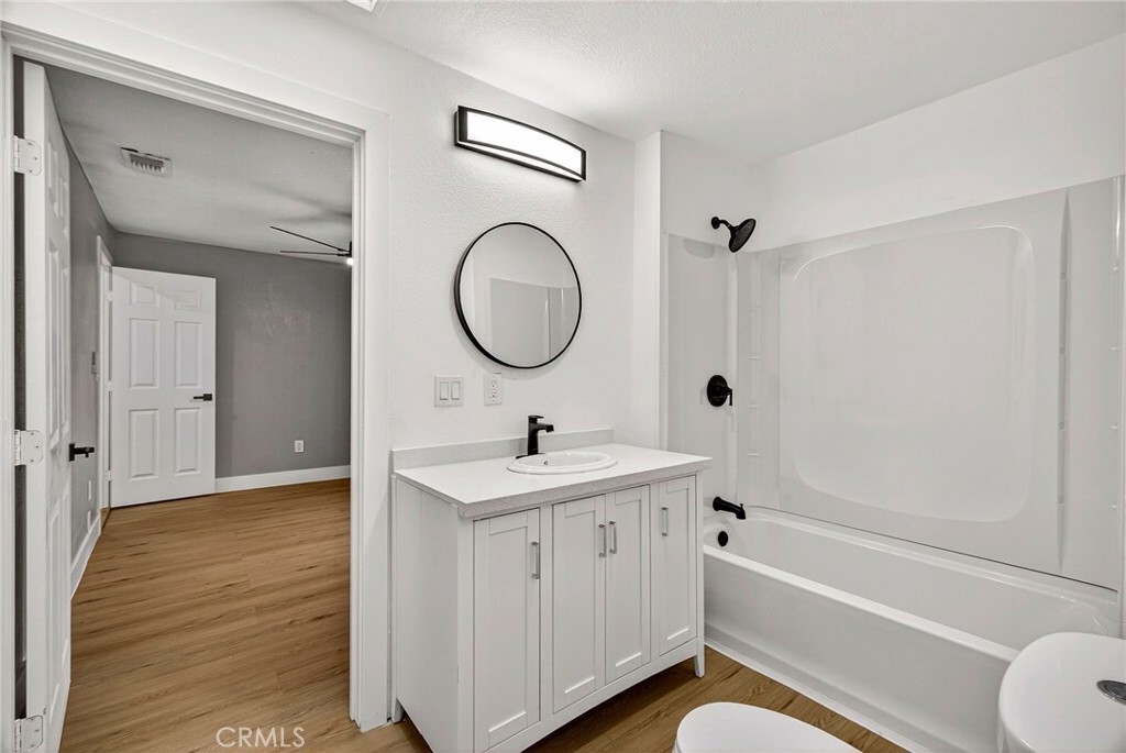 7040 Fulton Avenue Palermo, CA 95968 - Photo 24 of 53 a bathroom with a sink a toilet and a bathtub