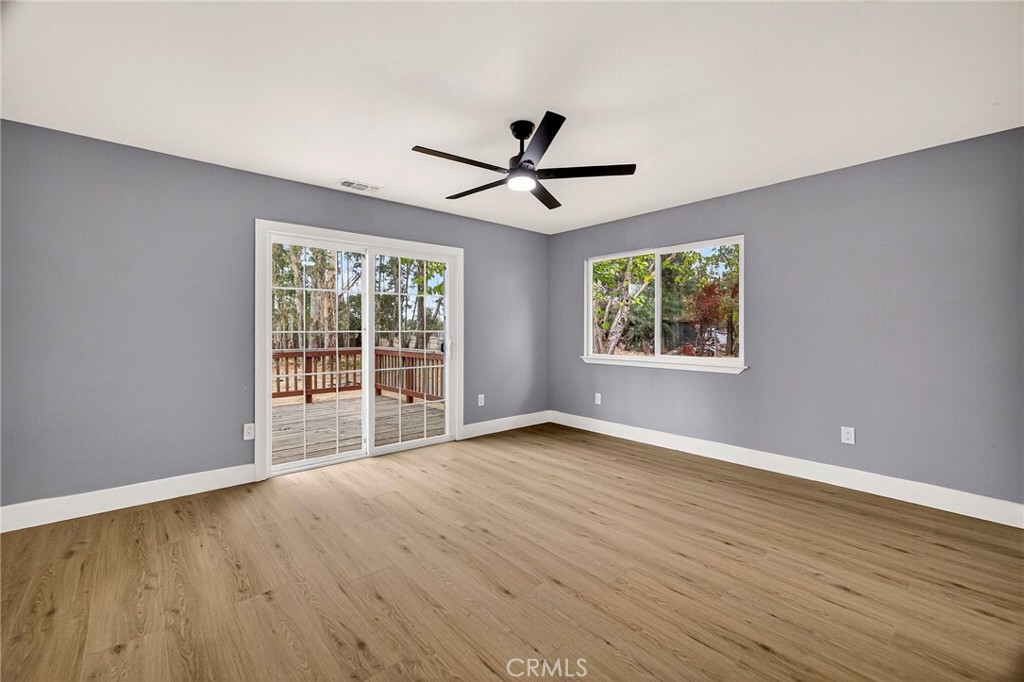 7040 Fulton Avenue Palermo, CA 95968 - Photo 25 of 53 a view of an empty room with a window and wooden floor