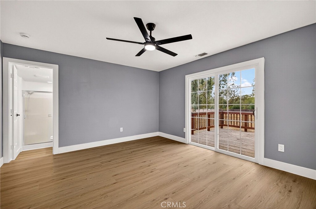 7040 Fulton Avenue Palermo, CA 95968 - Photo 27 of 53 an empty room with wooden floor and windows