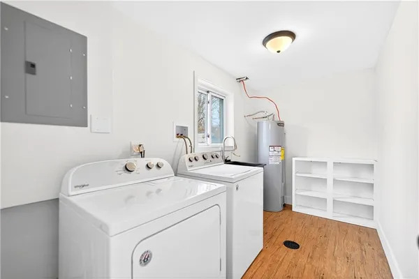 a front view of a house with a yard outdoor seating and barbeque oven