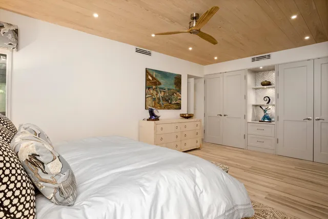 a bedroom with a bed and a cabinets