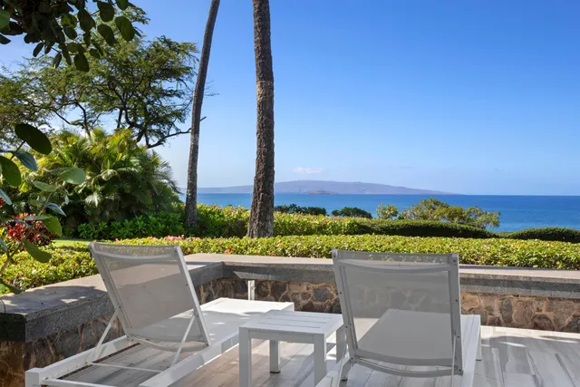 a view of a chairs and table on the terrace