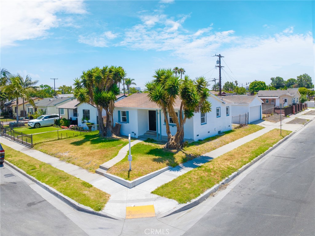 1242 West 134th Street Compton, CA 90222 - Photo 1 of 13 a view of a house with swimming pool and sitting area