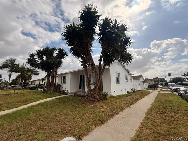 a view of a yard with cars
