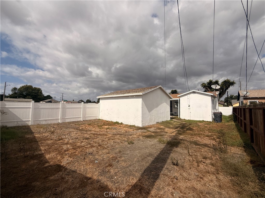 1242 West 134th Street Compton, CA 90222 - Photo 6 of 13 a view of a house with a yard