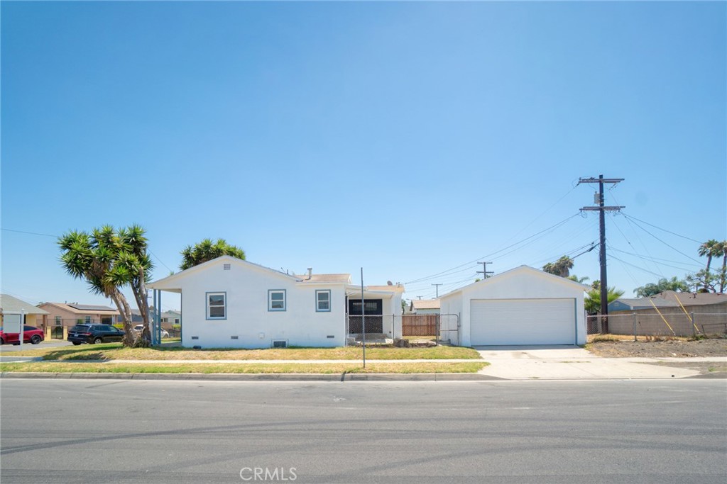 1242 West 134th Street Compton, CA 90222 - Photo 8 of 13 a house with a yard and a large window