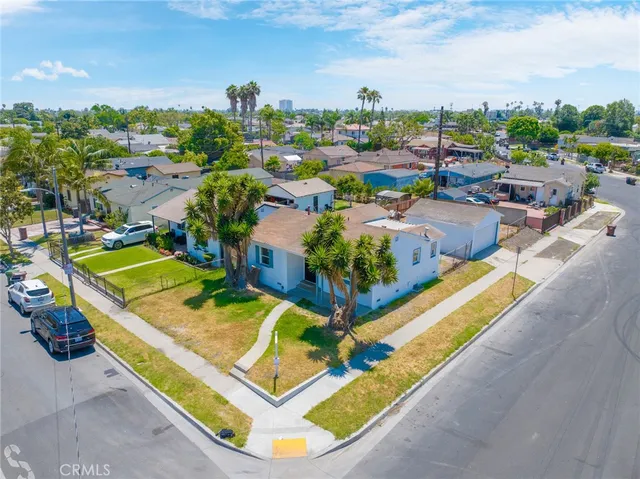 an aerial view of a house with a swimming pool