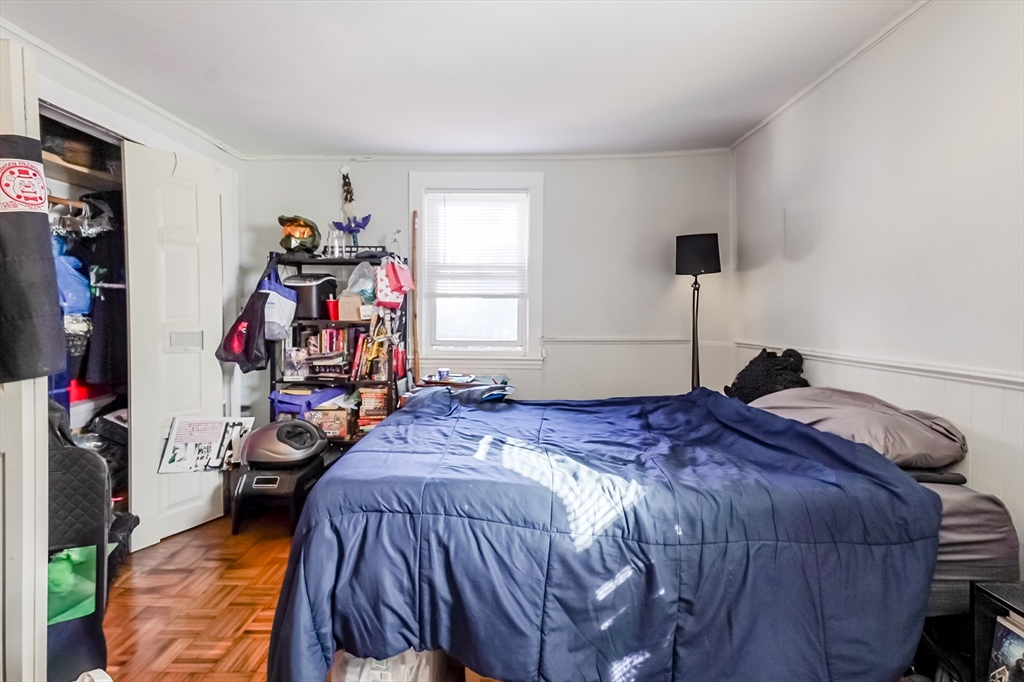 5 Oliver Street Randolph, MA 02368 - Photo 22 of 29 a bed room with a bed and a closet