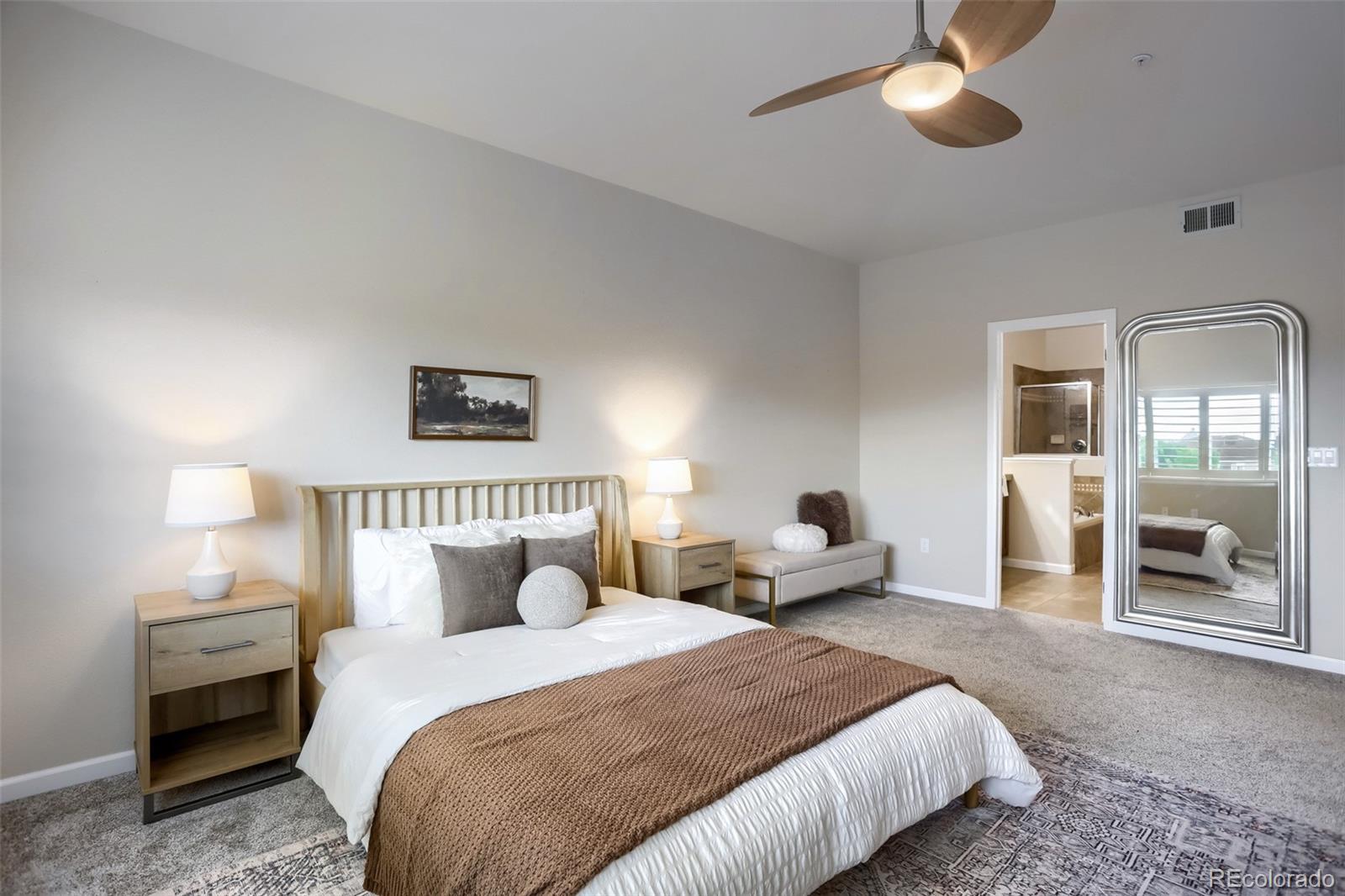 6232 Kilmer Loop, Unit 203 Golden, CO 80403 - Photo 21 of 33 a bedroom with bed and a chandelier