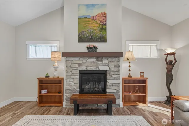 a dining room with furniture and wooden floor