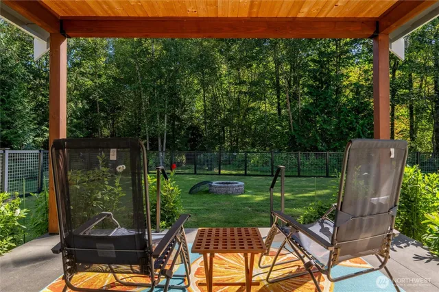 a front view of a house with a yard table and chairs