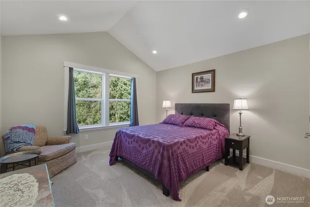 a bedroom with a bed and a night stand