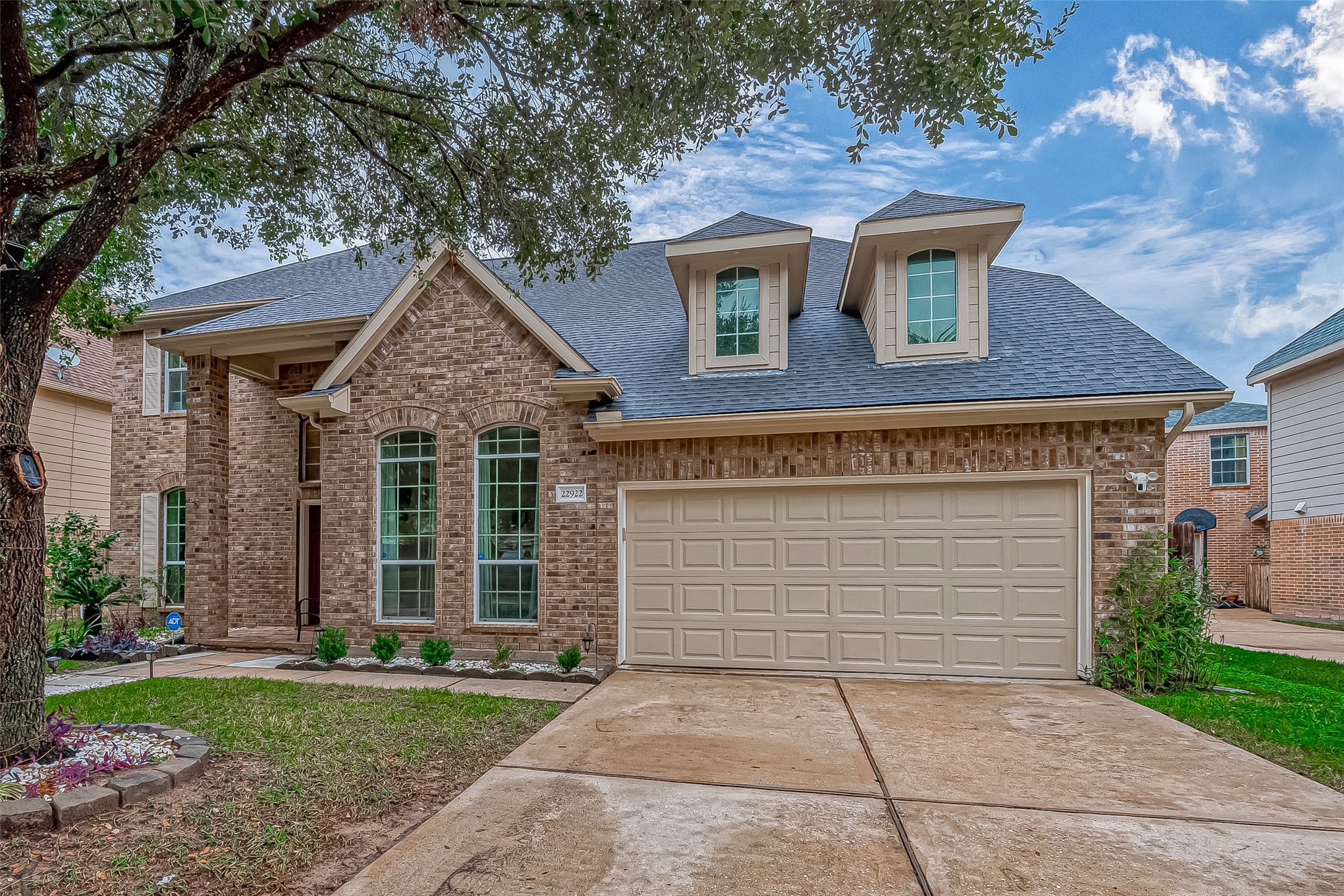 22922 Montclair Park Lane Spring, TX 77373 - Photo 2 of 46 a front view of a house with garden