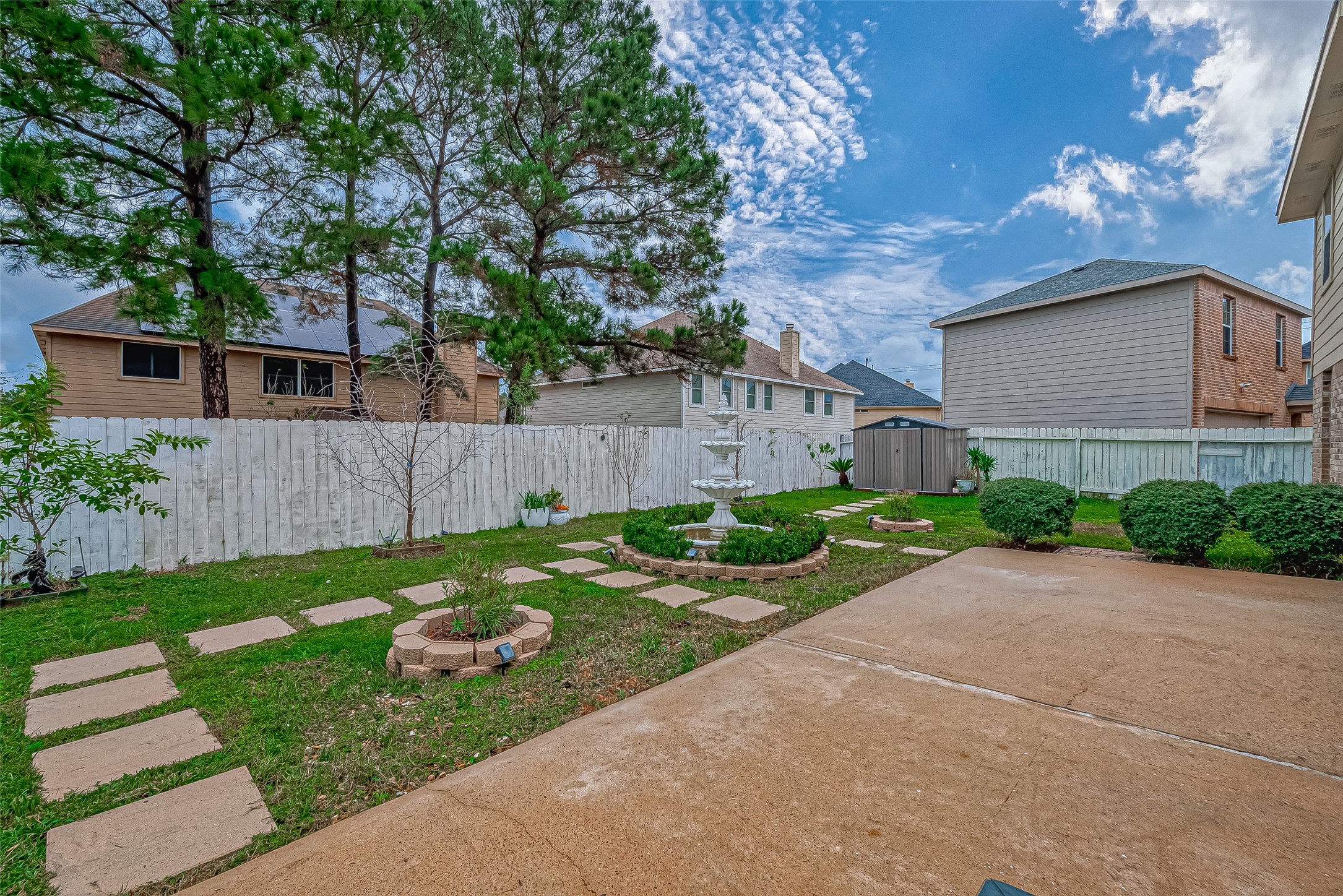 22922 Montclair Park Lane Spring, TX 77373 - Photo 44 of 46 a view of a house with a yard and a garden