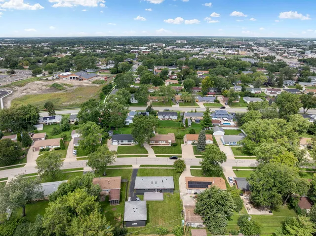 an aerial view of residential houses with outdoor space